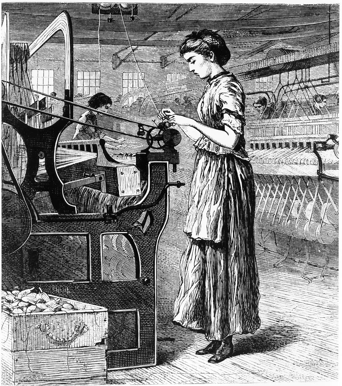 A mill girl operating a power loom in a factory.